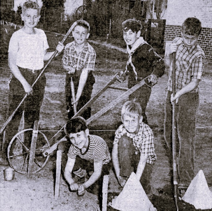 6 boys work in a garden