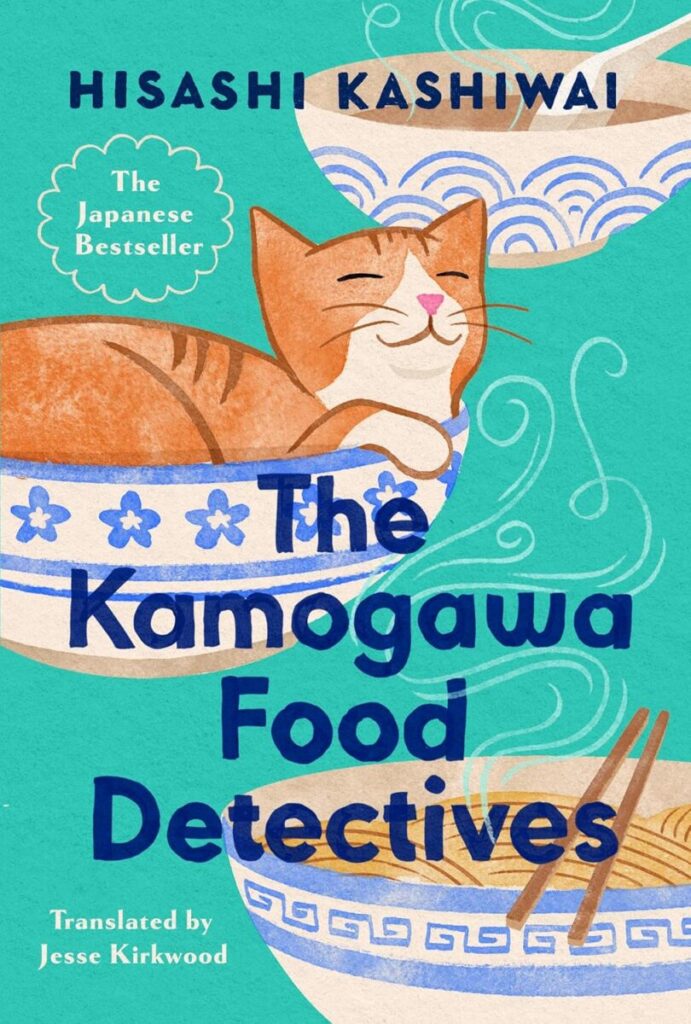 A ginger cat with his eyes closed in a needle bowl with blue and white designs, with two other bowls with ramen in them. On a teal colored background.