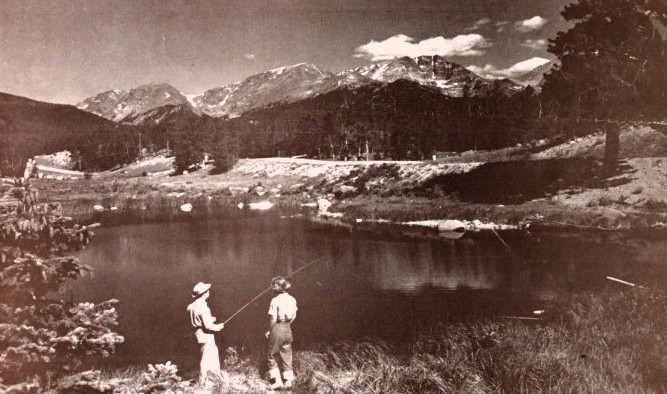 A man and a woman fish in a lake near Estes Park.