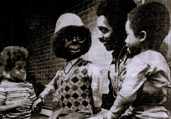 Comedian Willie Tyler and his puppet Lester entertain two young boys.