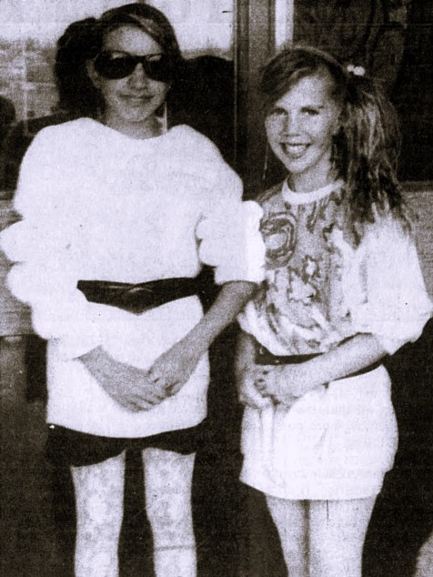 Two girls dress up as '80s pop stars.