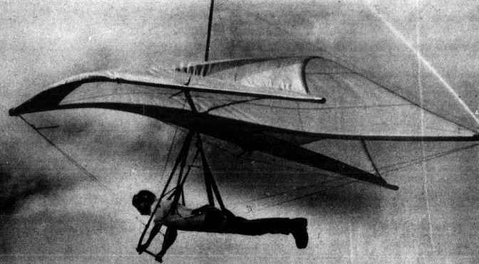 A man hang glides.