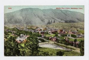 hand-colored postcard showing overview of Durango