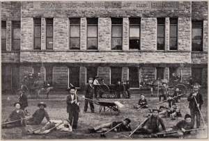 workmen resting in front of stone building front