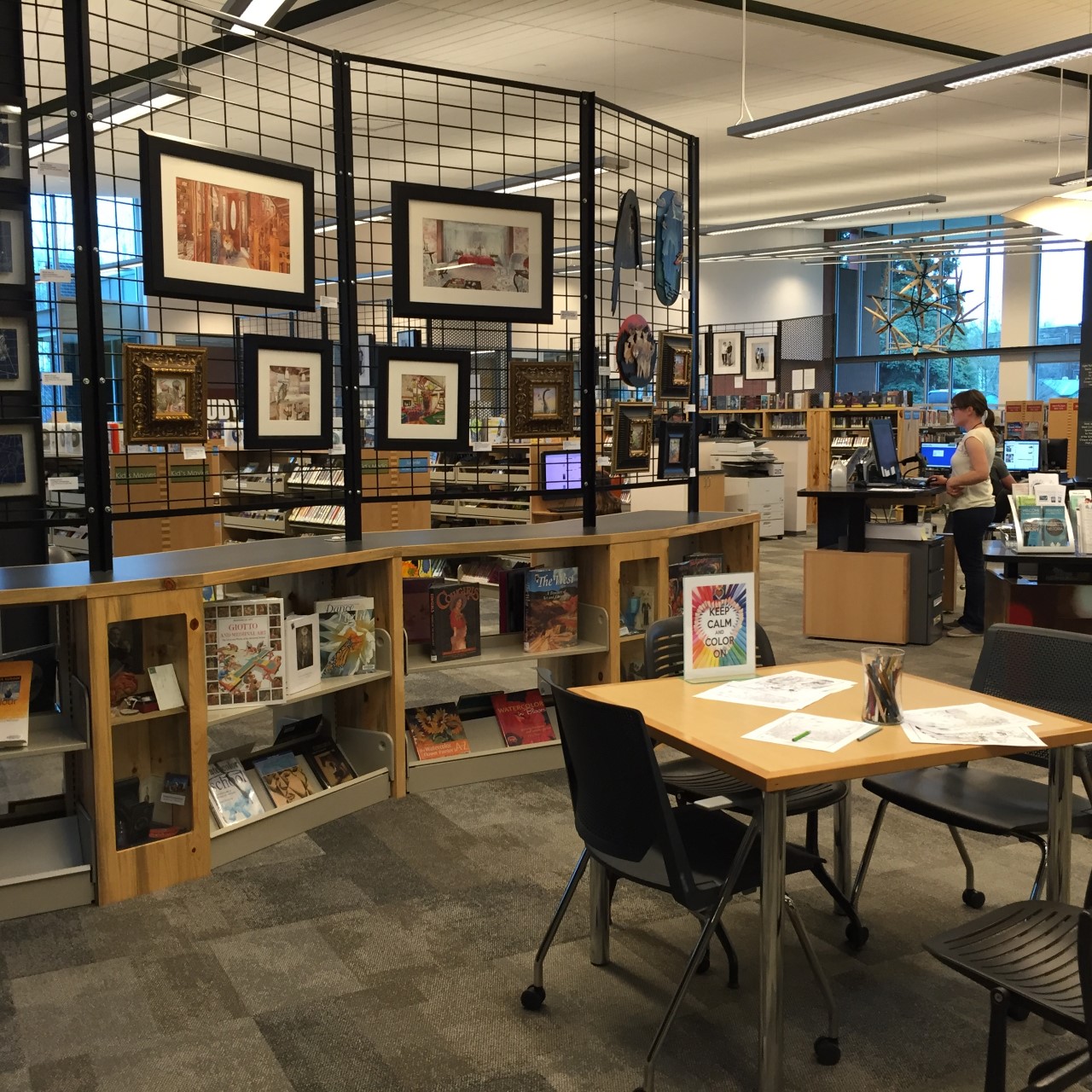 Image of Carbondale Library with art and book displays, a craft table, and a reference area. Photo by Sharon Morris.