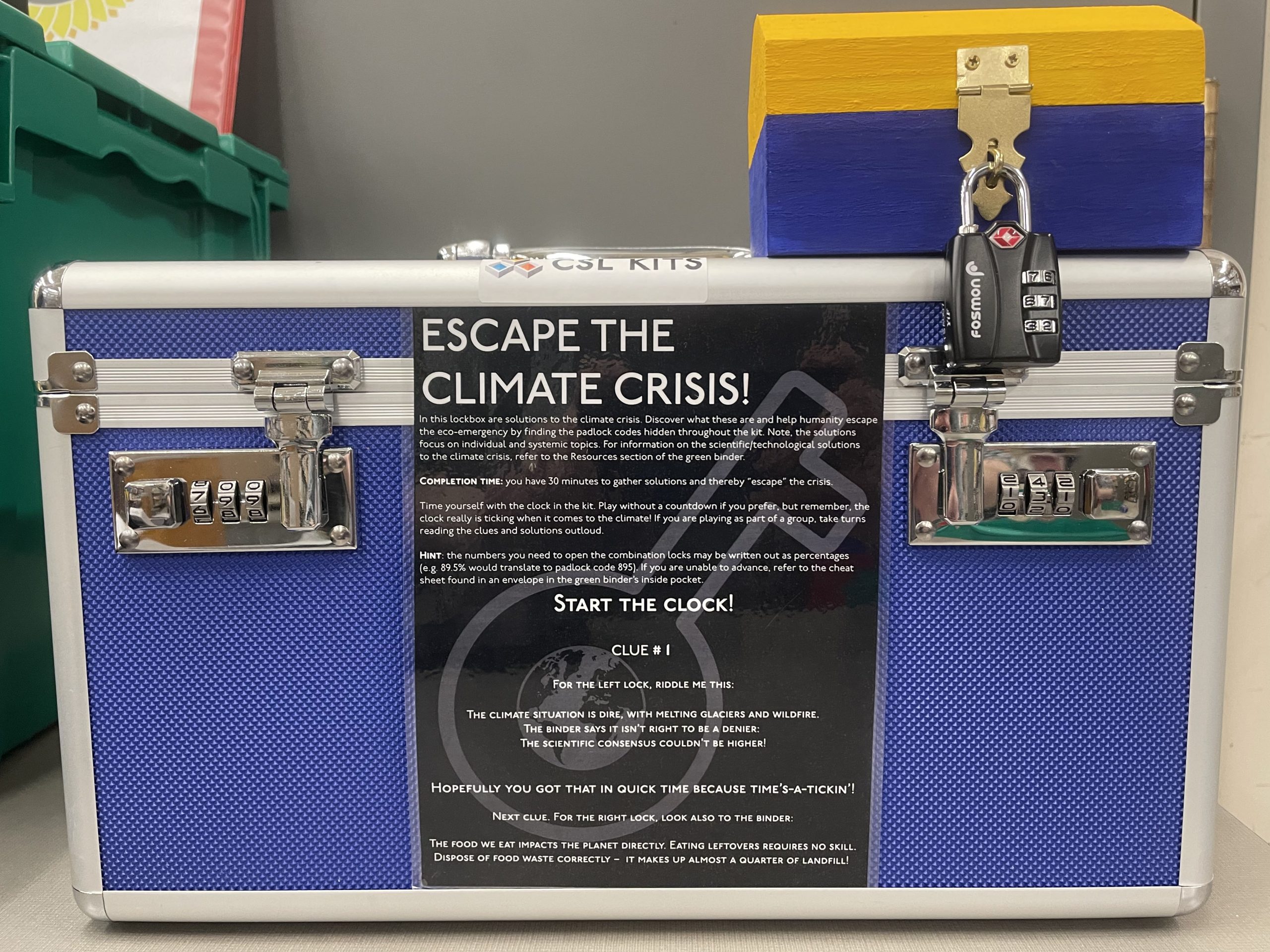 Escape the Climate Crisis lockbox, showing instructions and one example smaller box with padlock