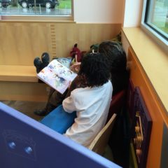 parent and child reading together