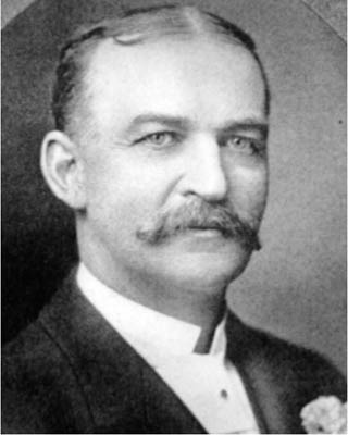 A black and white photographic headshot of Governor James H. Peabody