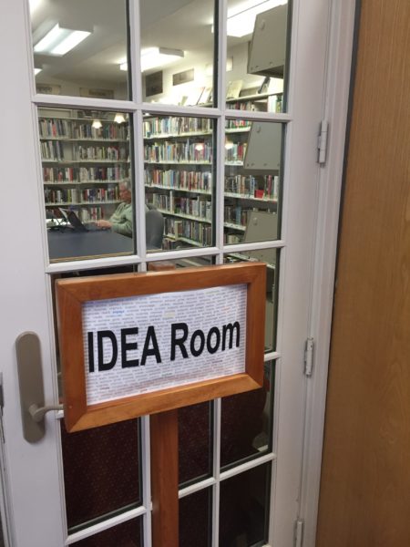 glass-paned door with sign saying "IDEA Room"