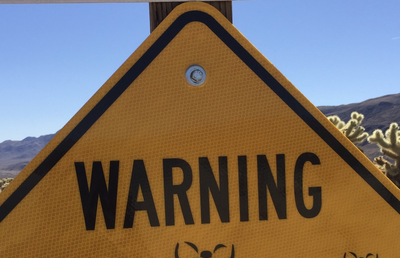 Caution sign with the word "Warning"