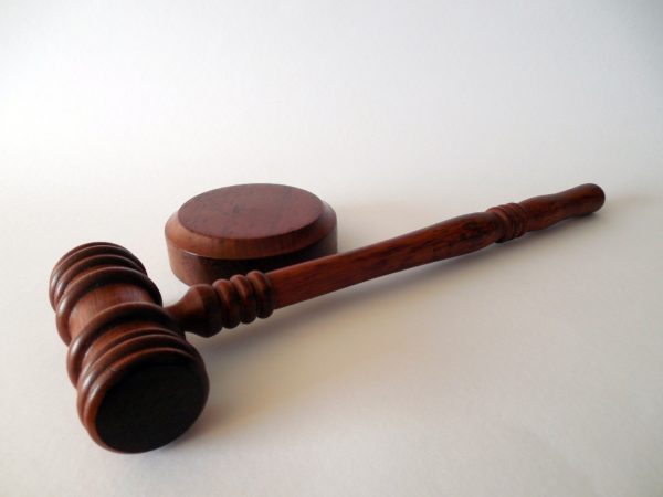 gavel resting on white background