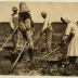 Four children wearing old-fashioned clothing hold gardening hoes in a dirt field.